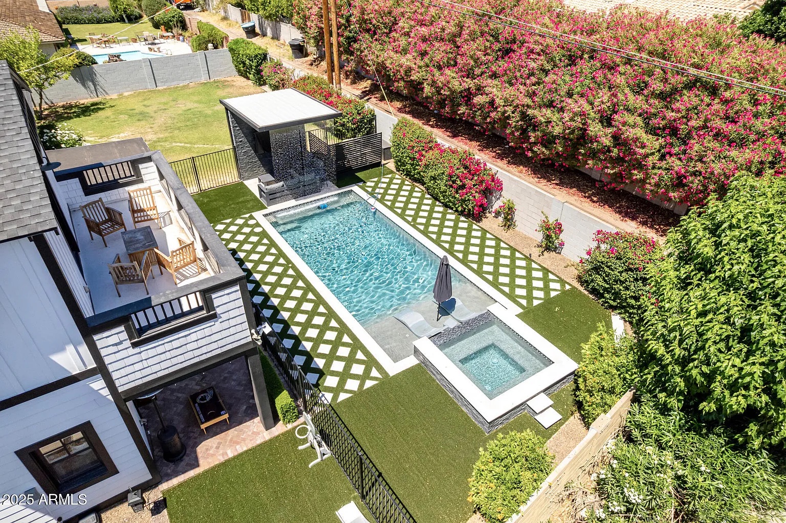 Aerial view of a completed backyard project with waterfall feature