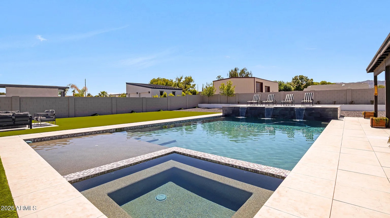 Pool and spa with mountain backdrop