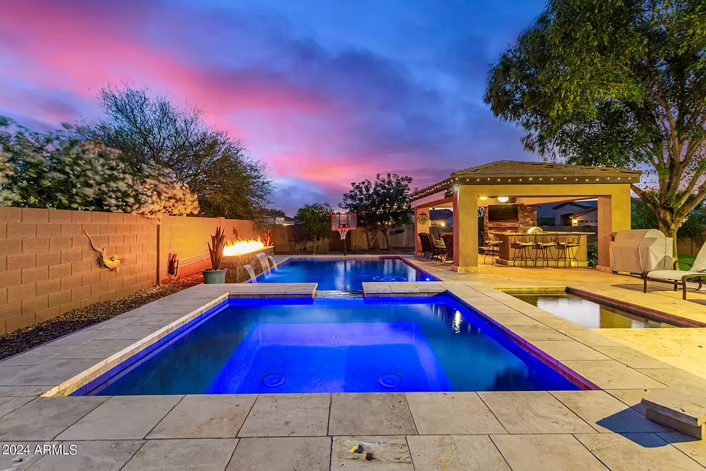 Twilight pool with fire glass feature