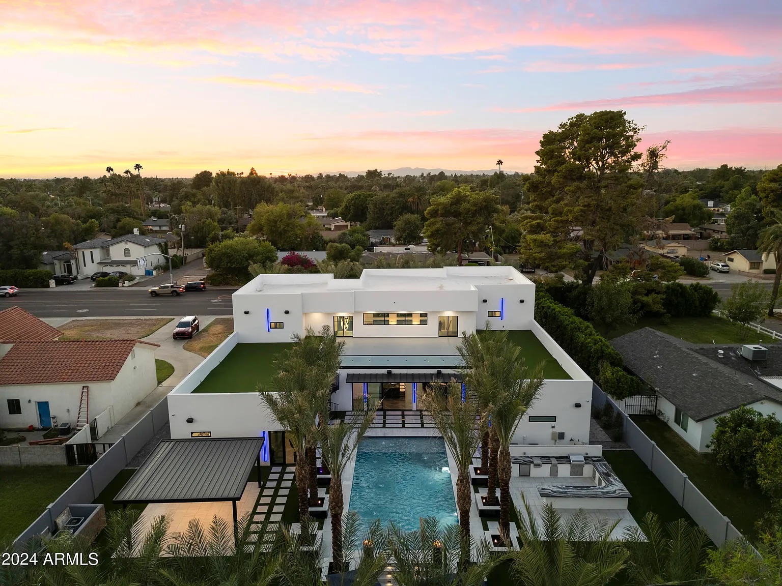 Twilight aerial view of a luxury Arizona backyard and pool